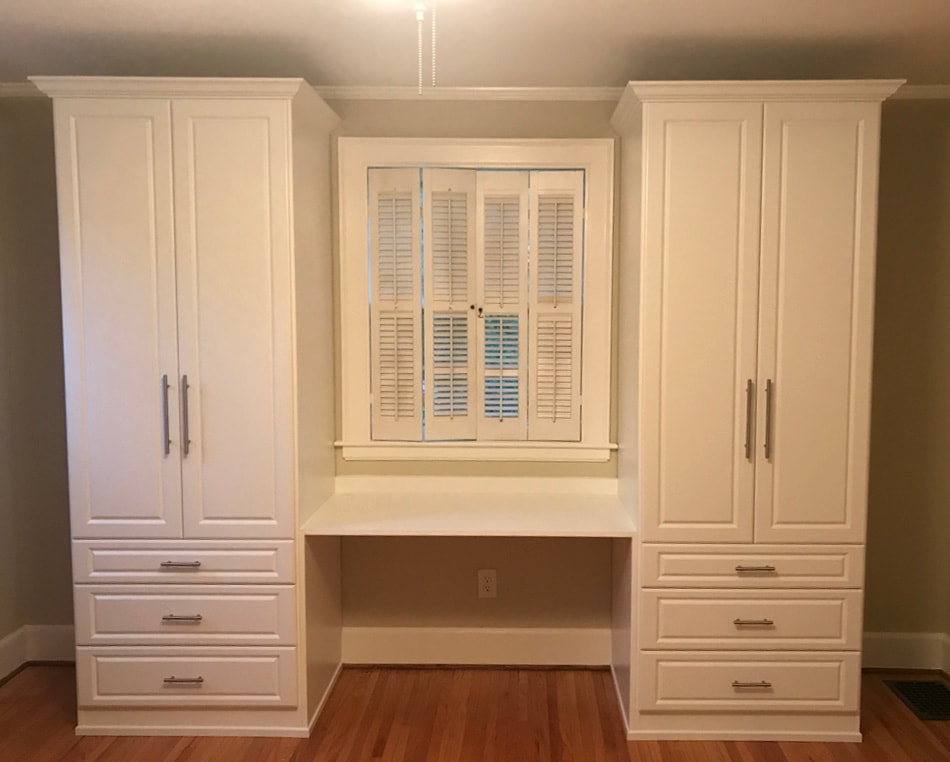 custom wall storage unit with built-in desk area